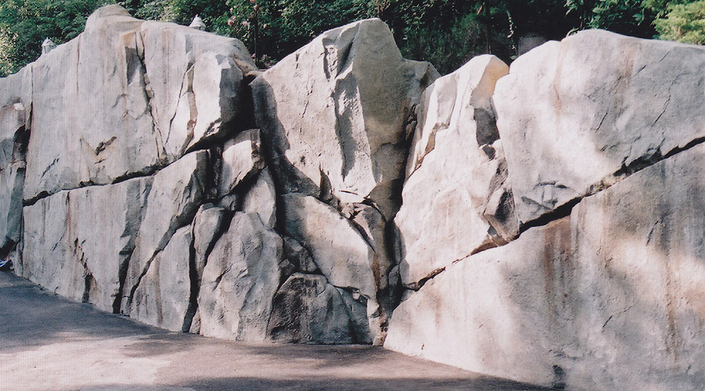 Artifical rockwork retaining wall.